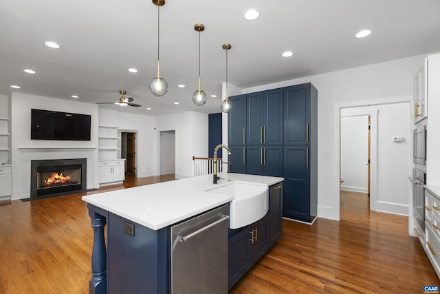 329 Carrsbrook Dr, Charlottesville, VA 22901 - kitchen with stainless steel appliances, a sink, blue cabinetry, ceiling fan, and light countertops