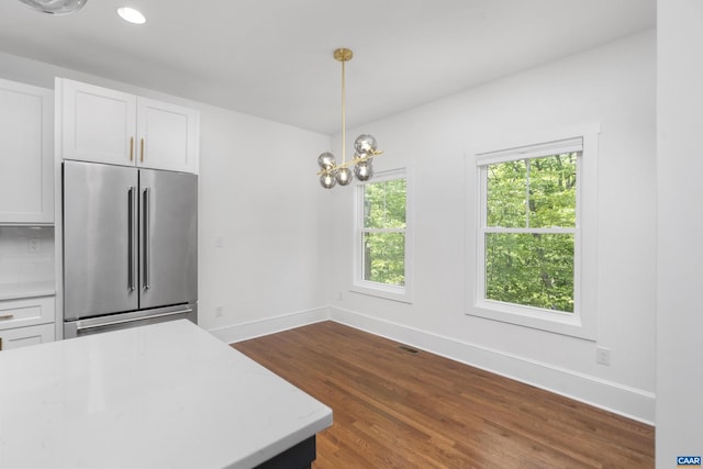329 Carrsbrook Dr, Charlottesville, VA 22901 - kitchen with high end refrigerator, white cabinetry, dark wood-type flooring, baseboards, and pendant lighting