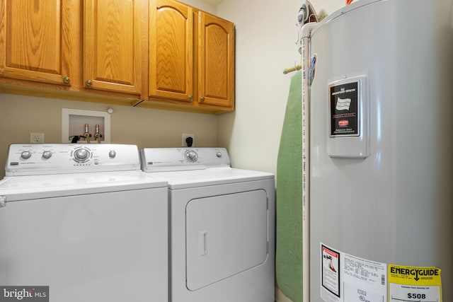 1389 Chami Dr Unit 171, Spring Grove, PA 17362 - washroom with electric water heater, cabinet space, and washer and clothes dryer