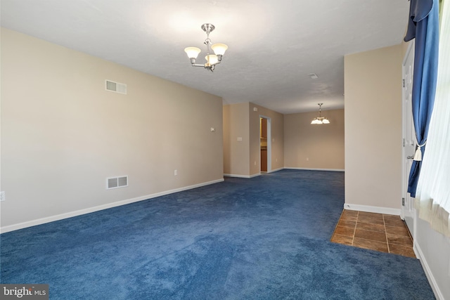 1389 Chami Dr Unit 171, Spring Grove, PA 17362 - carpeted empty room with a chandelier, baseboards, and tile patterned floors