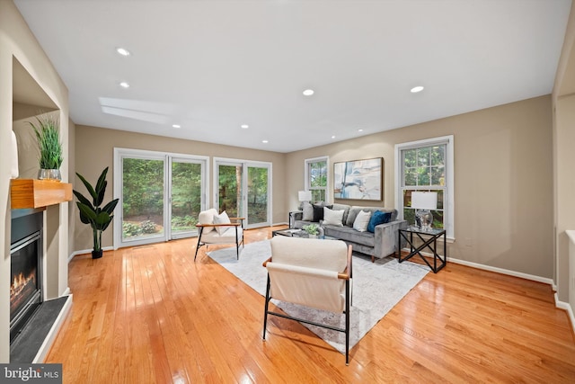 2300 Yvonnes Way, Dunn Loring, VA 22027 - living room featuring a glass covered fireplace, light wood-style flooring, baseboards, and recessed lighting