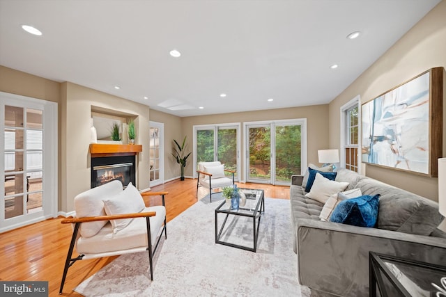 2300 Yvonnes Way, Dunn Loring, VA 22027 - living room featuring light wood finished floors, a glass covered fireplace, recessed lighting, and baseboards