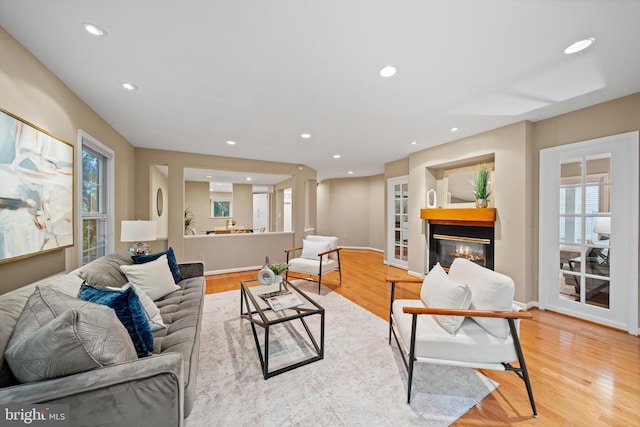 2300 Yvonnes Way, Dunn Loring, VA 22027 - living area with wood finished floors, recessed lighting, a glass covered fireplace, and baseboards