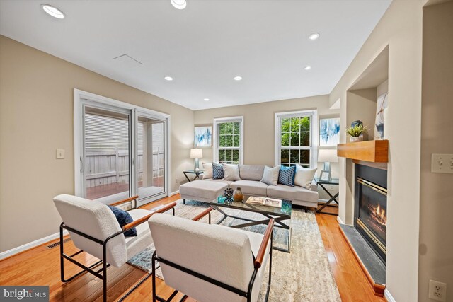 2300 Yvonnes Way, Dunn Loring, VA 22027 - living area featuring a glass covered fireplace, light wood-style floors, baseboards, and recessed lighting