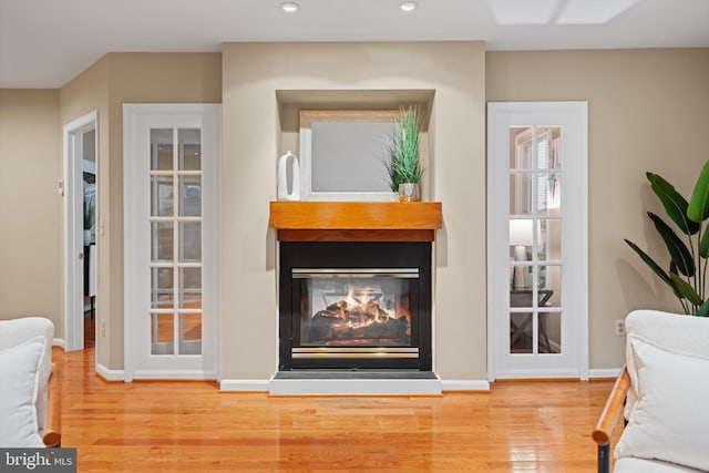 2300 Yvonnes Way, Dunn Loring, VA 22027 - living area featuring wood finished floors, a multi sided fireplace, recessed lighting, and baseboards