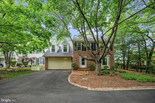 2300 Yvonnes Way, Dunn Loring, VA 22027 - view of front of home with brick siding, driveway, an attached garage, and roof with shingles