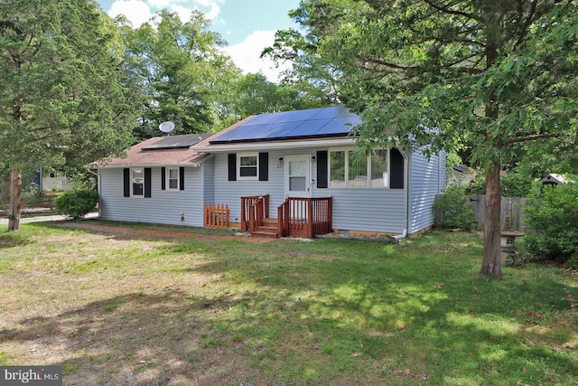 827 Rogers St, Lanoka Harbor, NJ 08734 - view of front of home featuring roof mounted solar panels