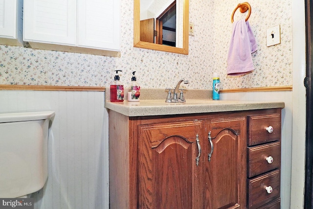 827 Rogers St, Lanoka Harbor, NJ 08734 - half bath with wallpapered walls, vanity, wainscoting, and toilet