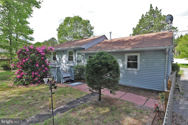827 Rogers St, Lanoka Harbor, NJ 08734 - view of front of home featuring a deck and roof with shingles