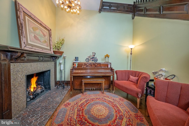 206 Price Ave Unit 2, Narberth, PA 19072 - sitting room featuring a fireplace, a chandelier, and wood finished floors