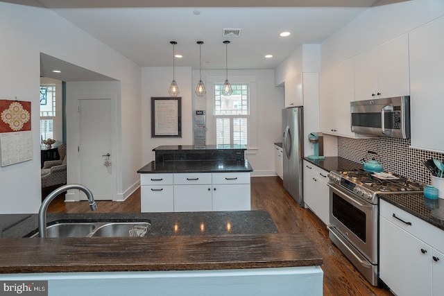 206 Price Ave Unit 2, Narberth, PA 19072 - kitchen featuring appliances with stainless steel finishes, a sink, dark wood-style flooring, a center island, and recessed lighting