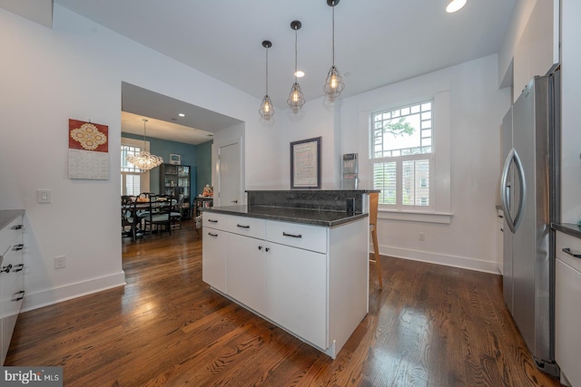 206 Price Ave Unit 2, Narberth, PA 19072 - kitchen featuring freestanding refrigerator, dark wood finished floors, white cabinetry, a chandelier, and decorative light fixtures