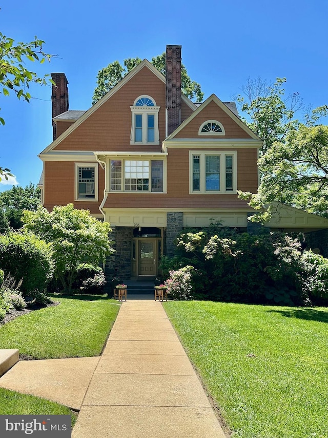 206 Price Ave Unit 2, Narberth, PA 19072 - view of front of property featuring a chimney, a front yard, and stone siding