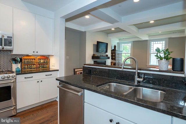 206 Price Ave Unit 2, Narberth, PA 19072 - kitchen with appliances with stainless steel finishes, a sink, dark stone countertops, white cabinets, and recessed lighting