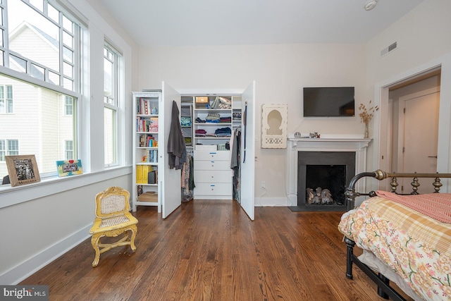 206 Price Ave Unit 2, Narberth, PA 19072 - bedroom with dark wood-style flooring, a fireplace, baseboards, and a closet