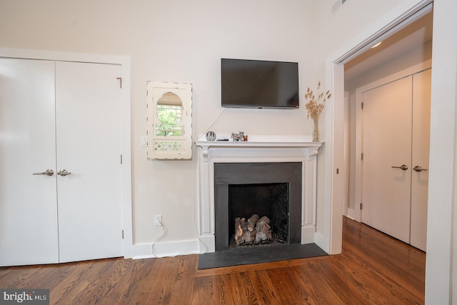 206 Price Ave Unit 2, Narberth, PA 19072 - living room featuring wood finished floors and a fireplace with flush hearth