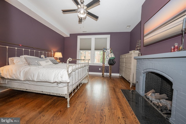 206 Price Ave Unit 2, Narberth, PA 19072 - bedroom with wood finished floors, baseboards, a fireplace, and ceiling fan