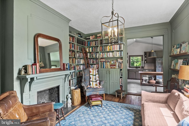 101 Warren Ave, Sewell, NJ 08080 - living area featuring a chandelier, wood finished floors, ornamental molding, and a fireplace