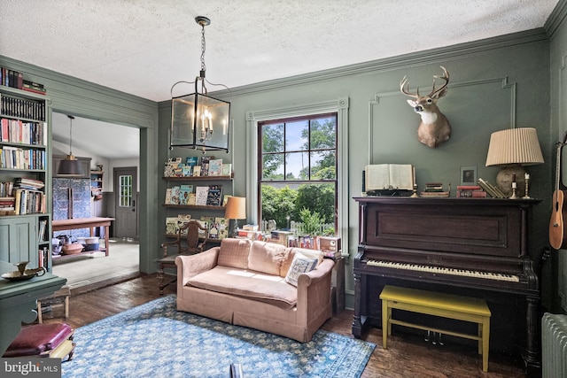 101 Warren Ave, Sewell, NJ 08080 - living area featuring a textured ceiling, a chandelier, wood finished floors, crown molding, and radiator