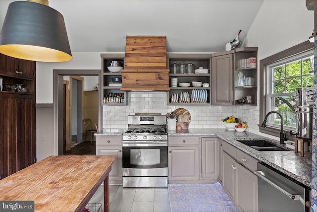 101 Warren Ave, Sewell, NJ 08080 - kitchen featuring appliances with stainless steel finishes, open shelves, decorative backsplash, and light stone counters