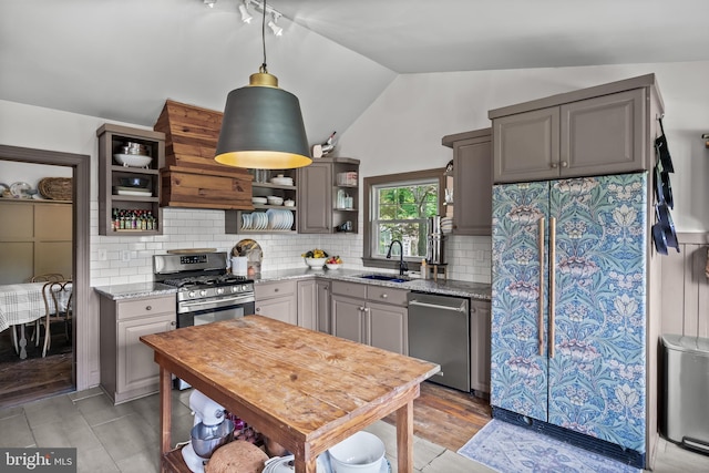 101 Warren Ave, Sewell, NJ 08080 - kitchen featuring open shelves, appliances with stainless steel finishes, custom exhaust hood, lofted ceiling, and light stone counters