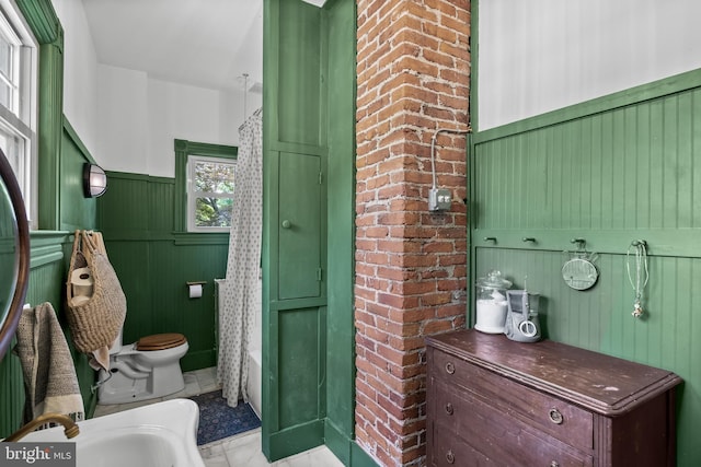 101 Warren Ave, Sewell, NJ 08080 - bathroom featuring wainscoting, marble look tile flooring, and shower / bath combination with curtain