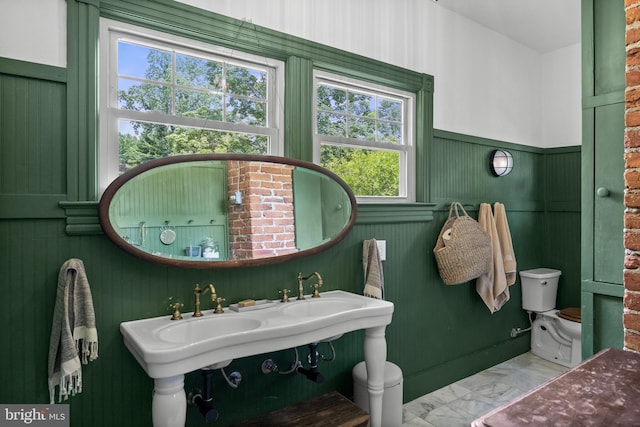 101 Warren Ave, Sewell, NJ 08080 - bathroom featuring healthy amount of natural light, a wainscoted wall, and marble look tile flooring