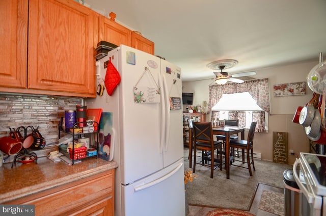 518 S Glenwood St, Allentown, PA 18104 - kitchen featuring white fridge with ice dispenser, a ceiling fan, carpet flooring, and tasteful backsplash