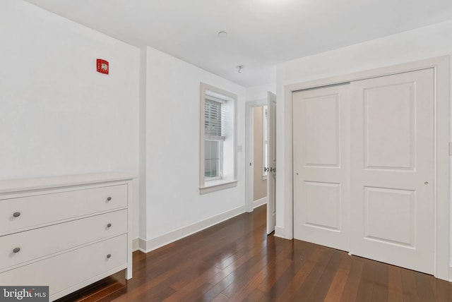 1522 Race St Unit 1, Philadelphia, PA 19102 - unfurnished bedroom with dark wood finished floors, baseboards, and a closet