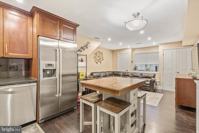 1522 Race St Unit 1, Philadelphia, PA 19102 - kitchen featuring stainless steel appliances, open floor plan, dark wood-type flooring, a kitchen breakfast bar, and recessed lighting