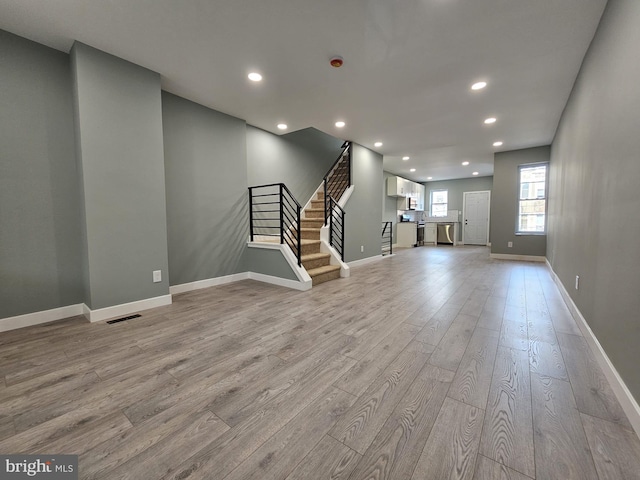 6022 N Lambert St, Philadelphia, PA 19138 - unfurnished living room featuring light wood finished floors, stairs, recessed lighting, and baseboards
