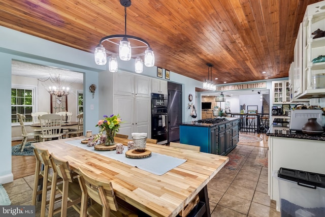 7001 Locust Ct, Owings, MD 20736 - dining room featuring wood ceiling, a chandelier, and light tile patterned floors