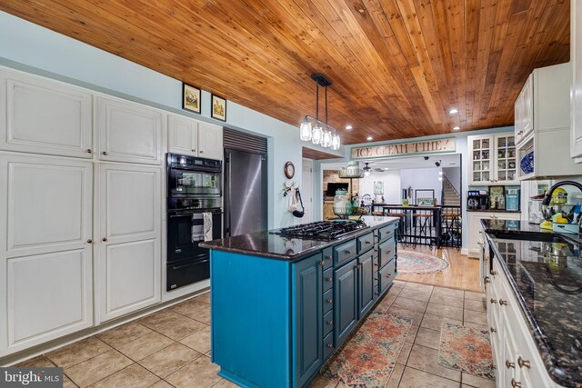 7001 Locust Ct, Owings, MD 20736 - kitchen featuring wood ceiling, blue cabinets, black appliances, a warming drawer, and a sink
