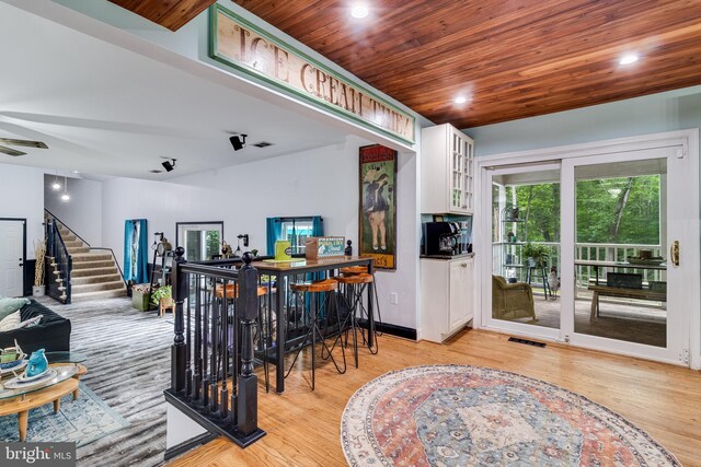 7001 Locust Ct, Owings, MD 20736 - dining room with light wood-style flooring, stairway, wooden ceiling, ceiling fan, and recessed lighting