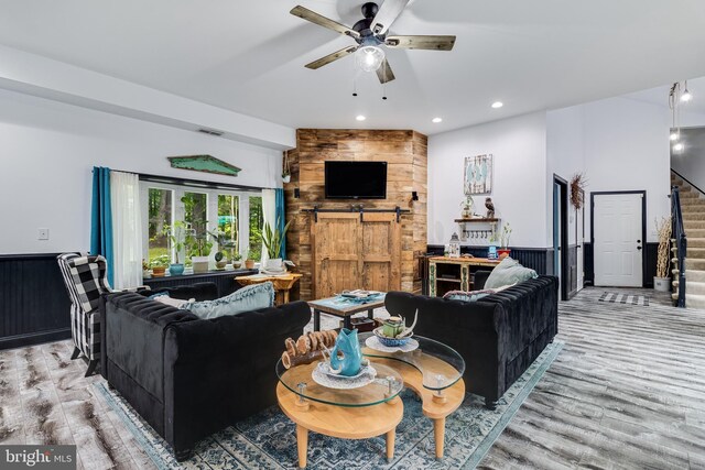 7001 Locust Ct, Owings, MD 20736 - living room with stairs, a barn door, a ceiling fan, light wood finished floors, and recessed lighting