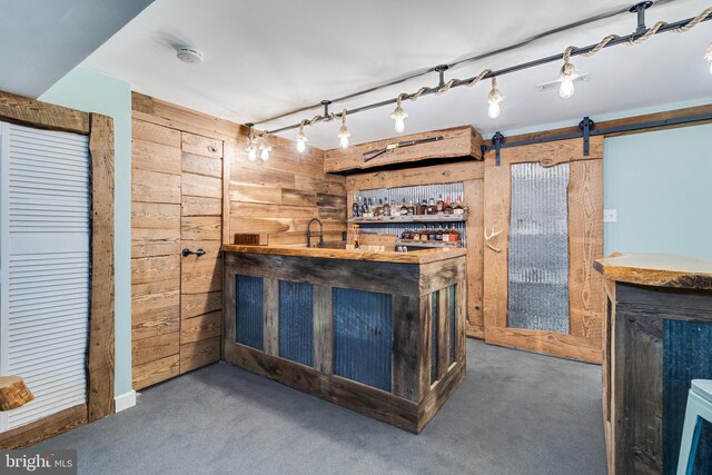 7001 Locust Ct, Owings, MD 20736 - indoor wet bar with wood walls and carpet