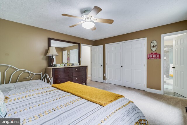 7001 Locust Ct, Owings, MD 20736 - bedroom with a closet, light carpet, baseboards, and a ceiling fan