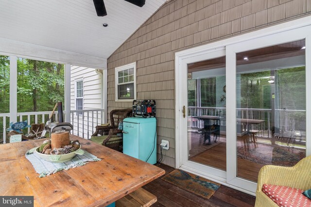 7001 Locust Ct, Owings, MD 20736 - sunroom featuring vaulted ceiling, outdoor dining space, and ceiling fan