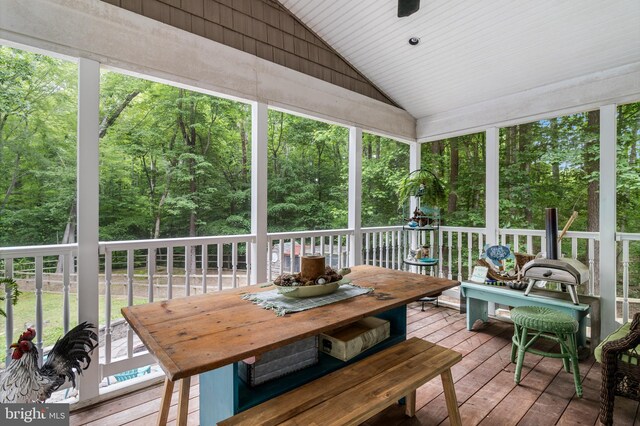 7001 Locust Ct, Owings, MD 20736 - sunroom / solarium with lofted ceiling, outdoor dining space, and a forest view