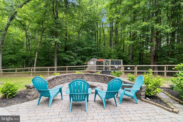 7001 Locust Ct, Owings, MD 20736 - fenced backyard with a patio area and an outdoor fire pit