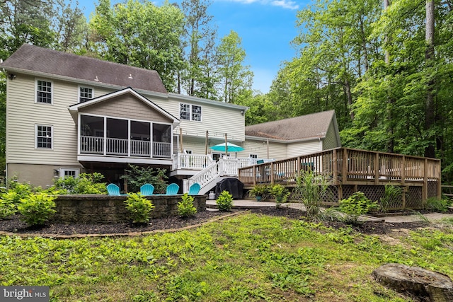 7001 Locust Ct, Owings, MD 20736 - rear view of house with a sunroom and a deck