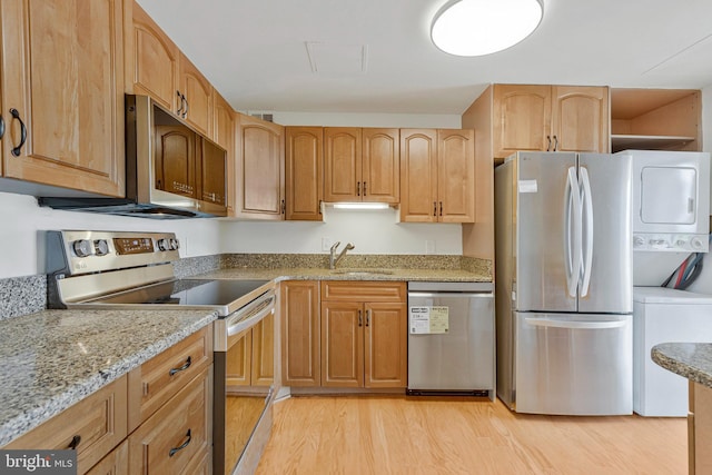 6800 Fleetwood Rd Unit 1219, Mclean, VA 22101 - kitchen with appliances with stainless steel finishes, a sink, light wood-type flooring, and light stone countertops