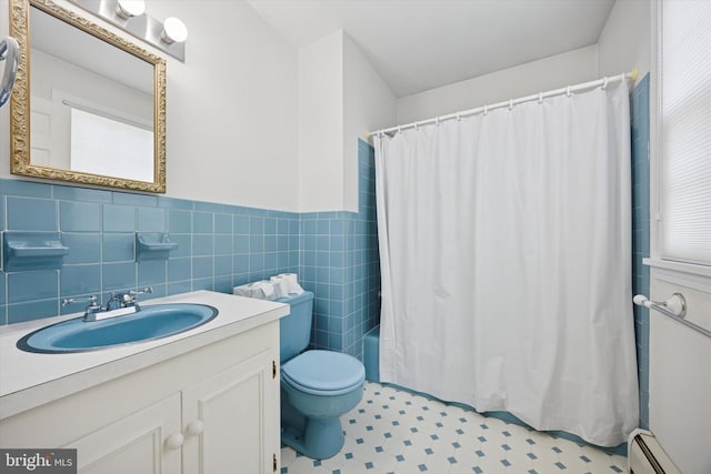 151 W Meade St, Philadelphia, PA 19118 - full bath featuring a baseboard radiator, toilet, vanity, a wainscoted wall, and tile patterned floors