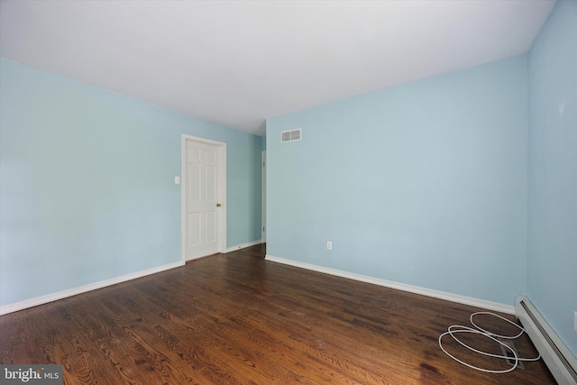 151 W Meade St, Philadelphia, PA 19118 - unfurnished room featuring a baseboard radiator, baseboards, and dark wood-type flooring