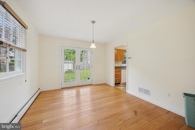 151 W Meade St, Philadelphia, PA 19118 - unfurnished dining area featuring a baseboard radiator, light wood-style flooring, plenty of natural light, and baseboards