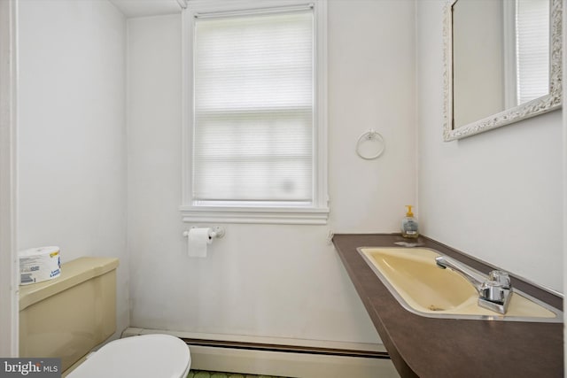 151 W Meade St, Philadelphia, PA 19118 - bathroom with baseboard heating, toilet, healthy amount of natural light, and vanity