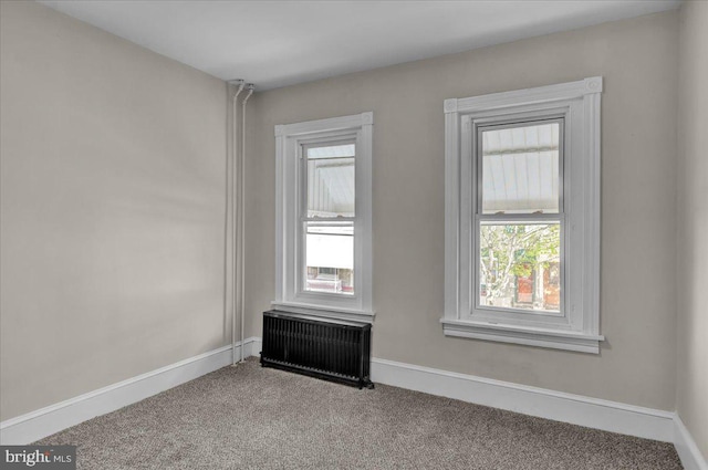 1120 N 10th St, Reading, PA 19604 - carpeted spare room featuring radiator heating unit and baseboards