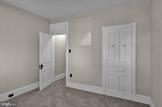 1120 N 10th St, Reading, PA 19604 - unfurnished bedroom with carpet flooring and baseboards