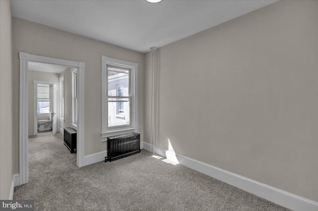 1120 N 10th St, Reading, PA 19604 - carpeted spare room with radiator heating unit and baseboards