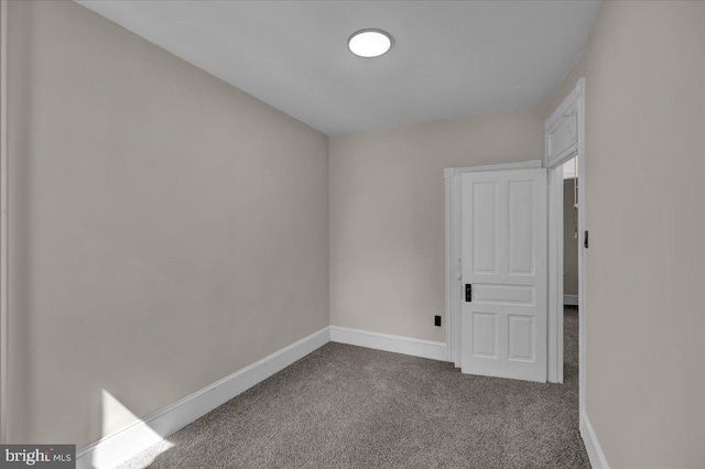 1120 N 10th St, Reading, PA 19604 - unfurnished room with dark colored carpet and baseboards